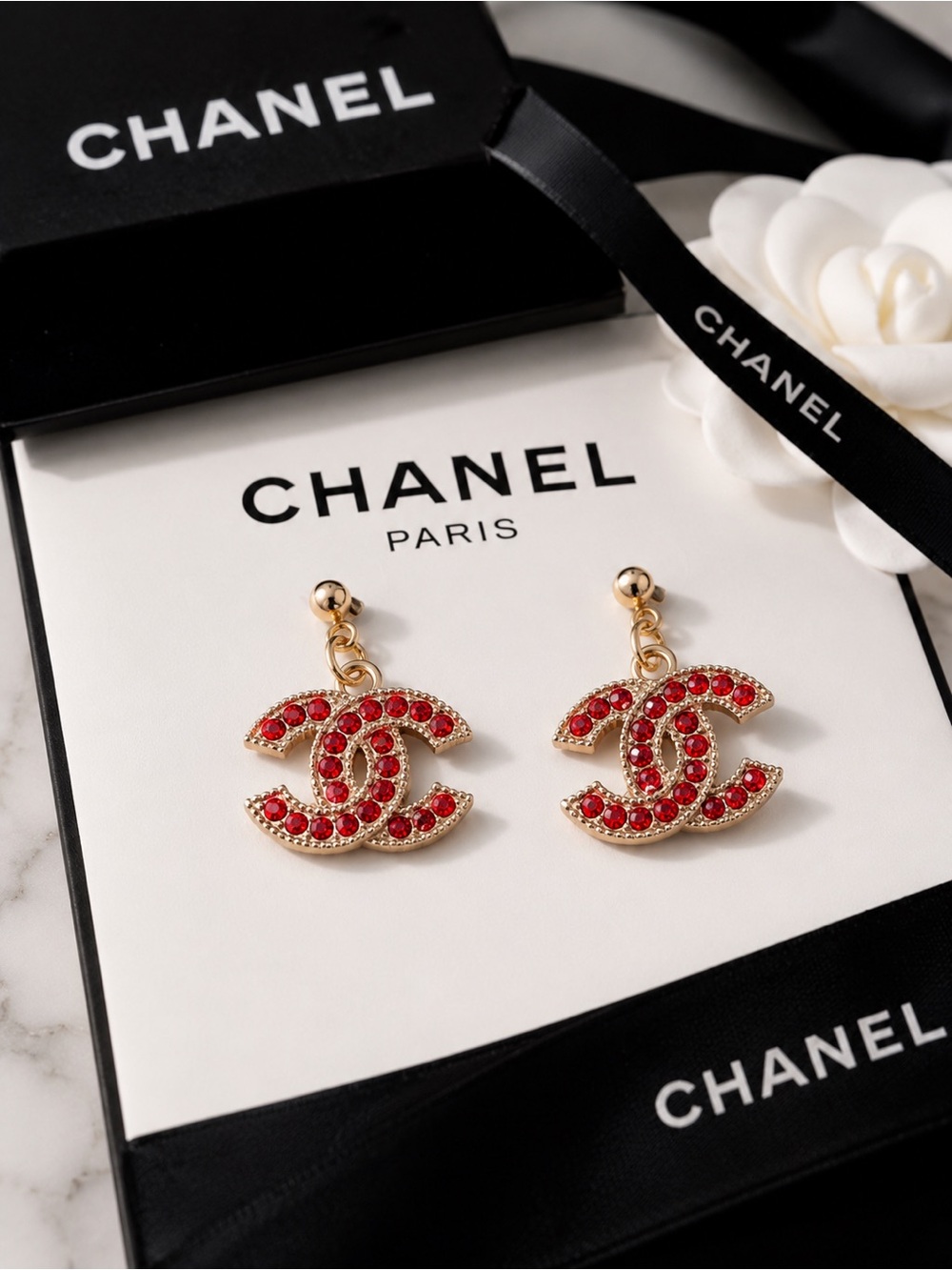 CHANEL Gold-Tone Interlocking CC Drop Earrings with Red Crystals